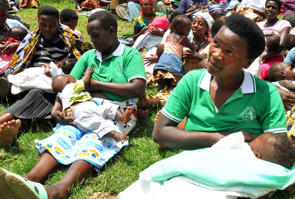 A group of women breastfeed their children during a nursing class. Photo credit: Kate Consavage/USAID