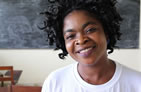 Thumbnail image of a woman in a classroom smiling for the camera.Photo credit: Liz Eddy/MCSP