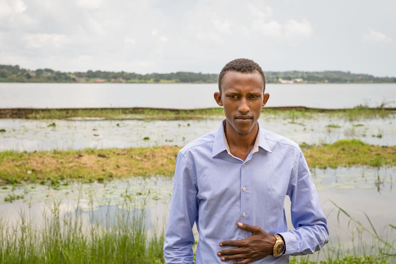 Photo of Francis Angumya in front of Lake Victoria.