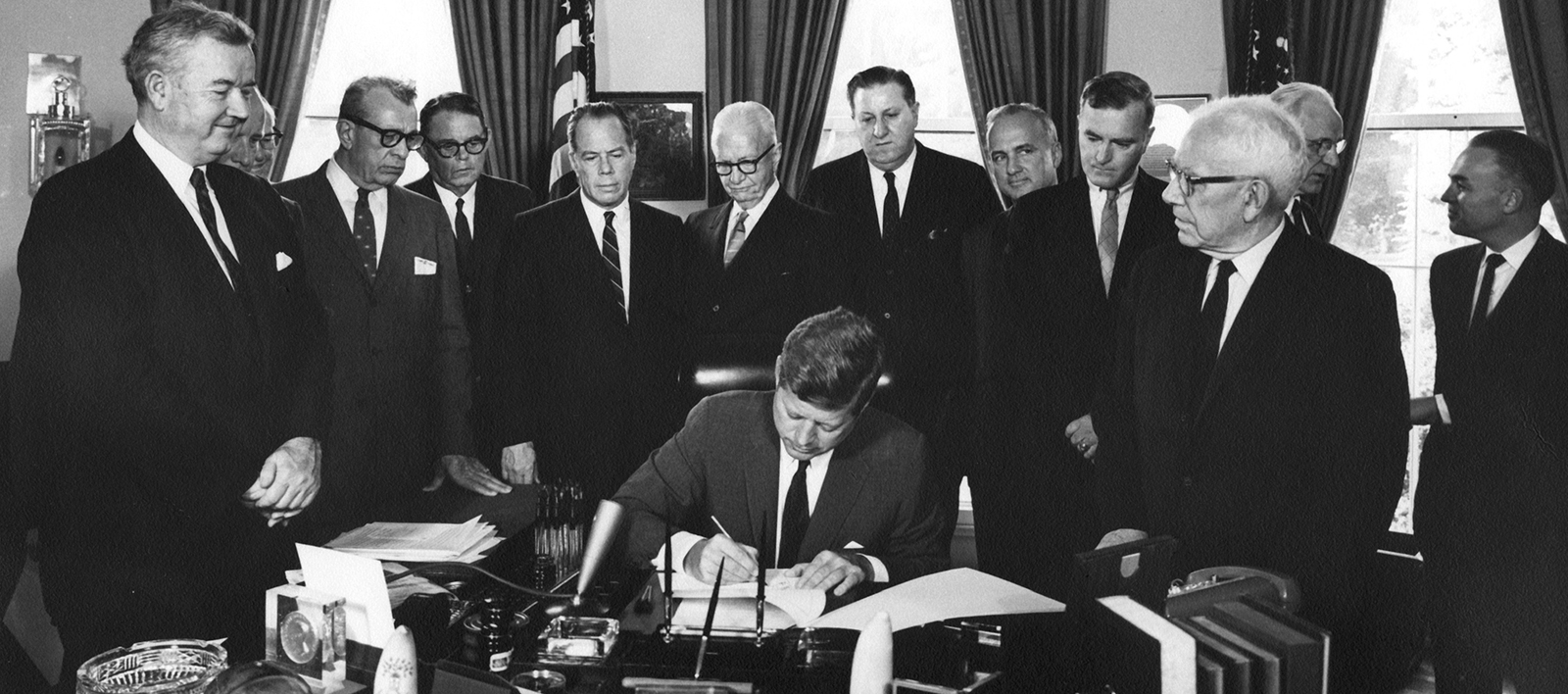 On November 3, 1961, President John F. Kennedy signs the Foreign Assistance Bill creating USAID