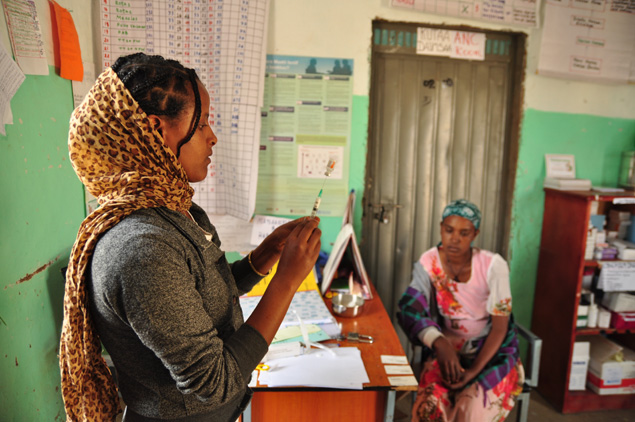 A health worker prepares a vaccination