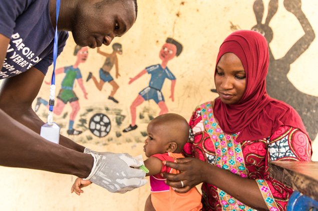 A health worker tends to a child in Mali.