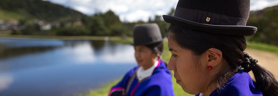 Colombian girls standing next to a lake. Credit: ACDI VOCA / David Osorio
