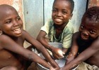 Children wash their hands in Ghana, where USAID supports prevention and treatment of trachoma, a blinding eye disease.