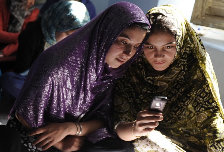 Afghan women sit in a class and study using mobile phones in Kabul. Jawad Jalali/AFP 