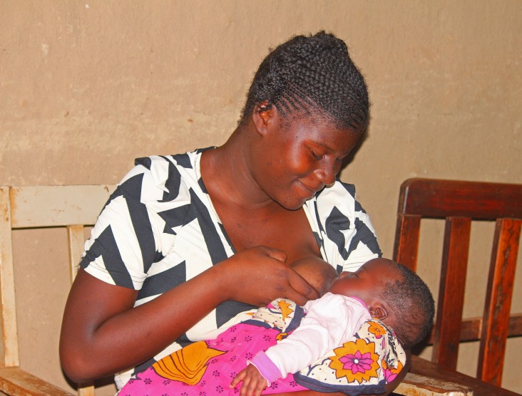 17 year old Melisa Akinyi,  PPH survivor breastfeeds her baby at her grandparents' home in Kakamega County