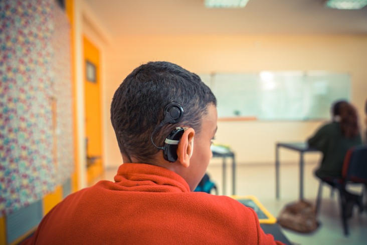 Hard of hearing student participates in an activity in Moroccan classroom