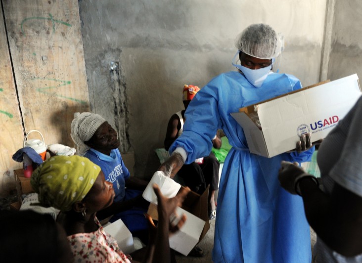 Personnel distribute USAID hygiene kits at a Cholera Treatment Center