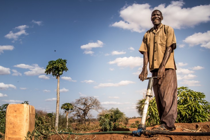 Dominic and his wife have transformed their arid land in Makueni County into viable productive farmland using water-harvesting technology they learned from training supported by USAID and the World Food Program (WFP).