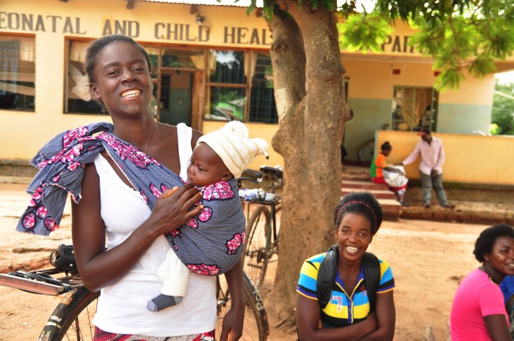 A woman and her baby outside of a maternal and child health clinic in Zambia