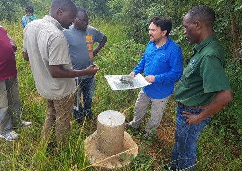 Photo: Environmental Division Team Leader, David Arnoldo Mijan (center), leads USAID’s Monitoring and Evaluation (M&E) team during a site visit of protected areas in Lutembwe Forest in Chipata.