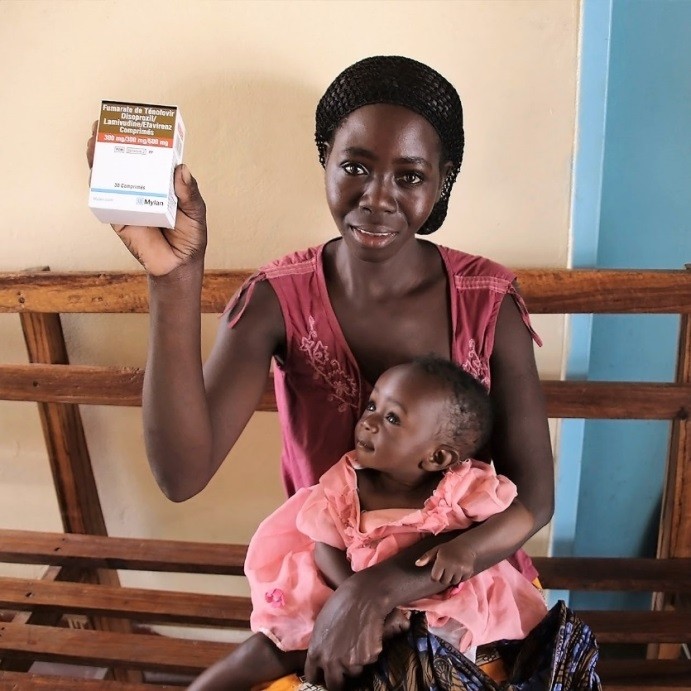 A mother and her child visit their local health facility to pick up antiretroviral therapy medication.