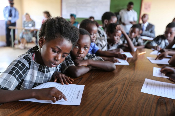 A young learner practices her reading as part of the USAID Let's Read Project at Kasupe Primary School in Chipata.