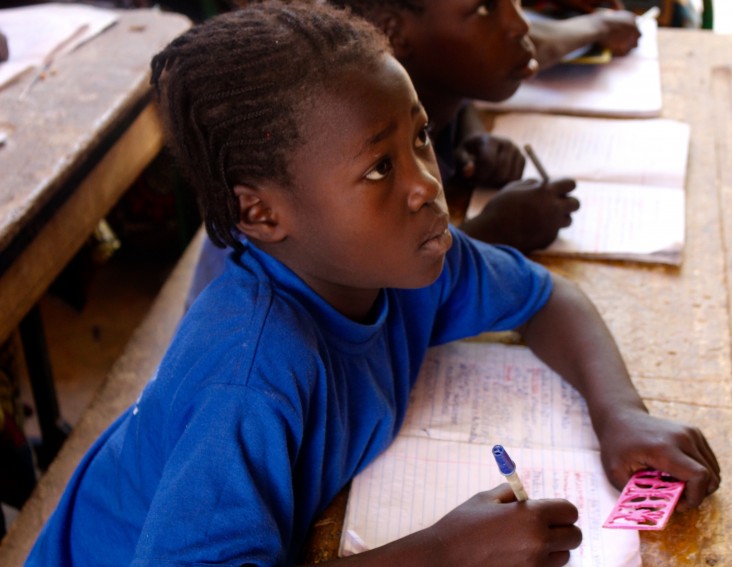 A young girl learning to read in Dosso region, Niger