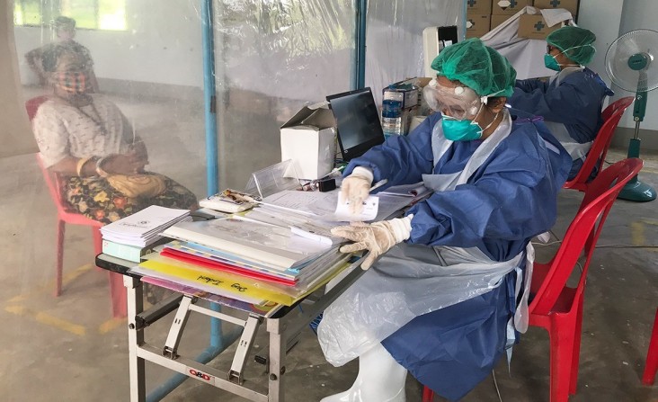 Health workers and clients from the clinics follow the social distancing guidelines, wear PPE, and provide handwashing facilities to prevent the spread of COVID-19.