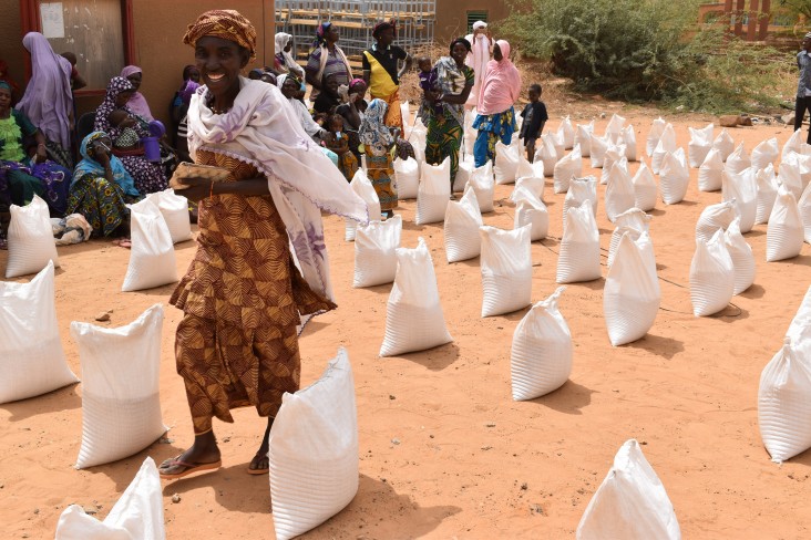 Woman in Burkina Faso surrounded by sacks of flour from the recent harvest. PHOTO: Fatoumata Mint Sidi