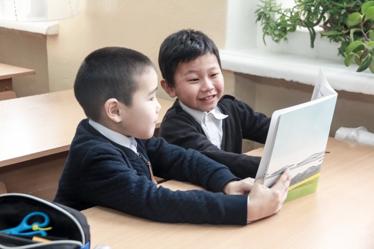 Kids reading in Kyrgyzstan