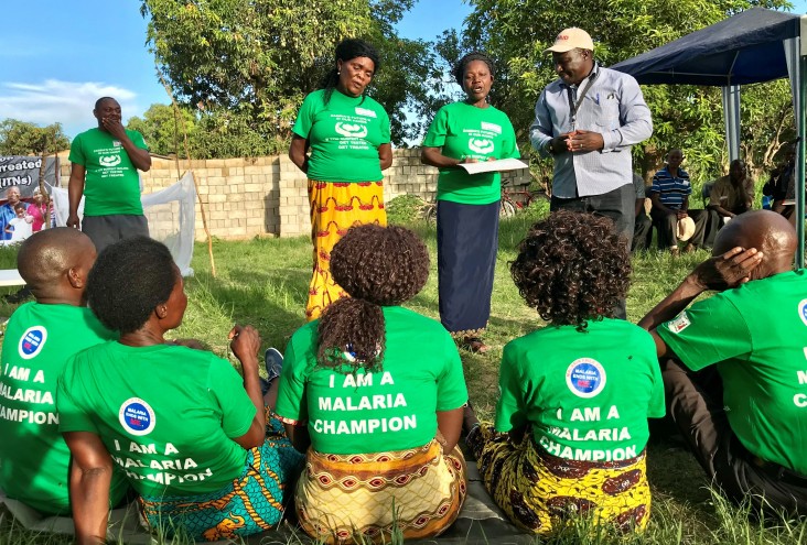 Malaria champions participate in a community discussion in Zambia