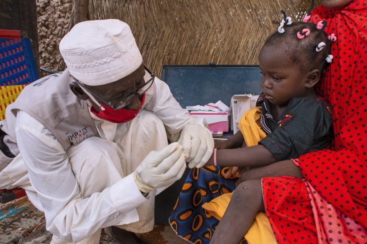 A child receives a rapid test for malaria