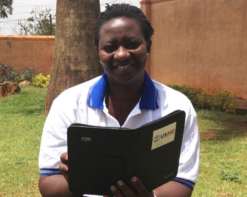 Christine Ninsiima wirelessly submits data collected with electronic tablets during trachoma mapping exercises.