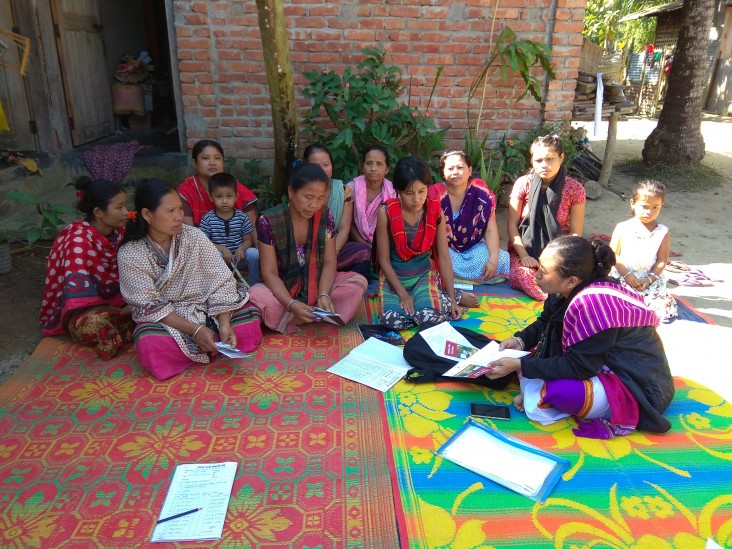 A group of women in the village of Dakkhin Headman meeting in courtyard