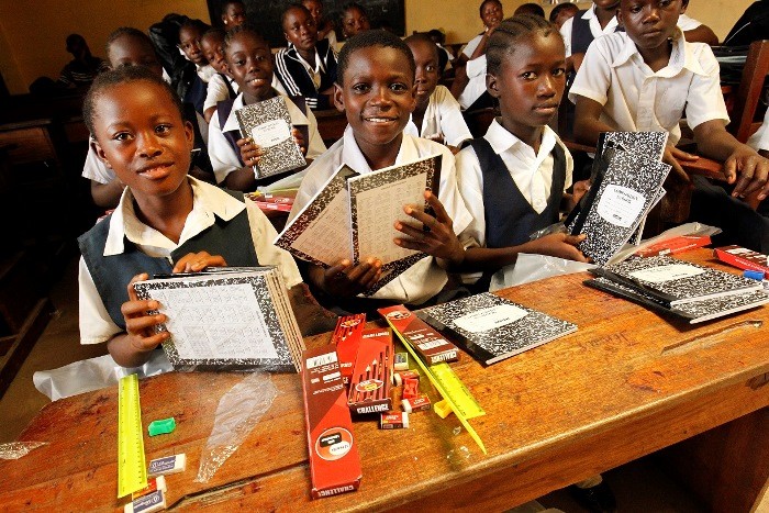 Students with USAID provided school supplies