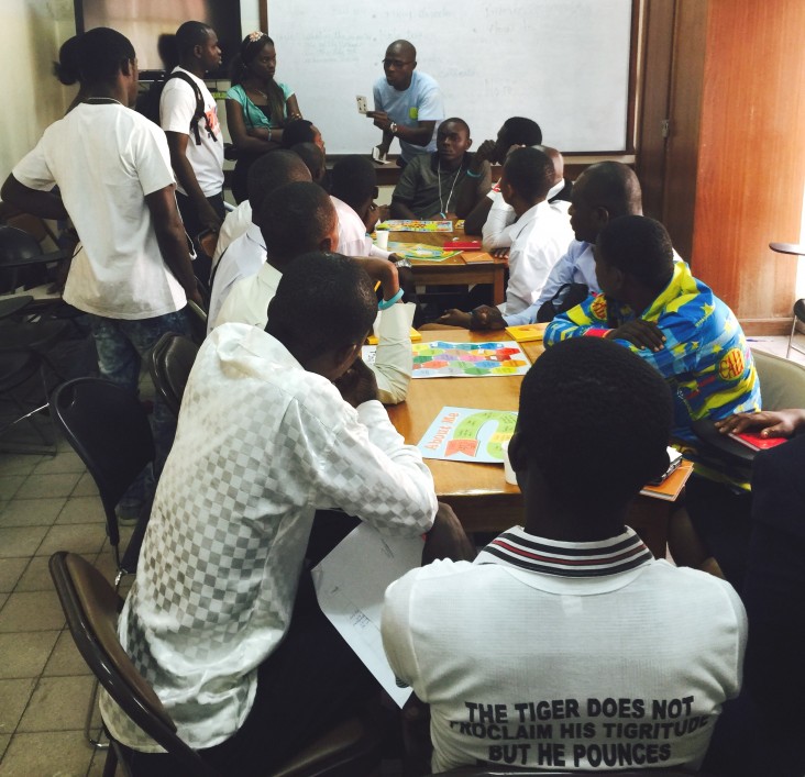 Members of an English club work through an exercise at a teacher resource center in the DRC.