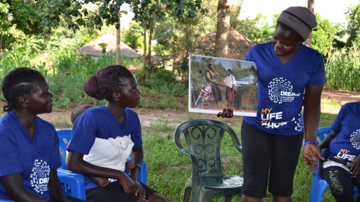 Photograph of a peer champion from the DREAMS partnership visiting adolescent girls and young women in their homes to hold small group or individual discussions on ways to prevent HIV and unplanned pregnancies. Photo Credit: USAID/Communication for Healthy Communities