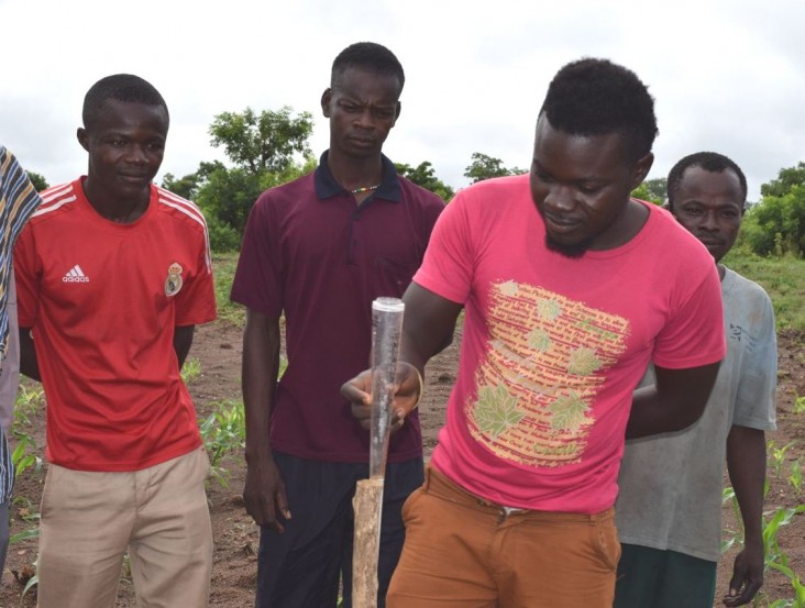 USAID helps farmers access tools such as this rain gauge that will help them adapt to climate change.