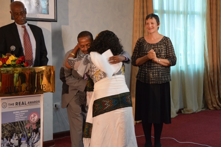 USAID official Jeanne Rideout watches as one of four Ethiopian mothers receive the 2014 REAL Awards.