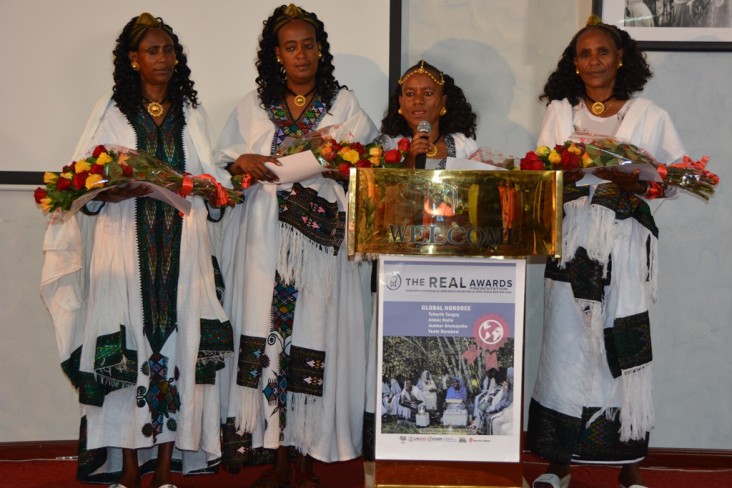 Teberih Tsegay gives remarks on behalf of four Ethiopian mothers who received the 2014 REAL Awards.