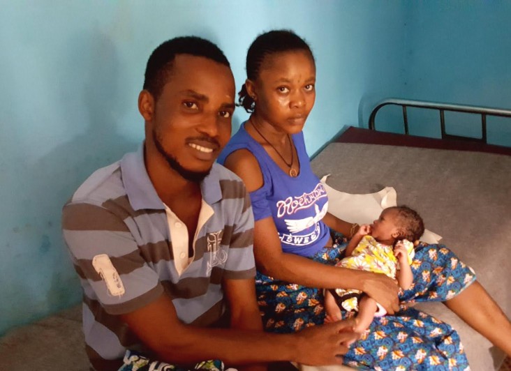 James and Salematu Bindu welcome the birth of their daughter, Kadiatu, at the maternal and child health post in the Malama suburb of Freetown, Sierra Leone.