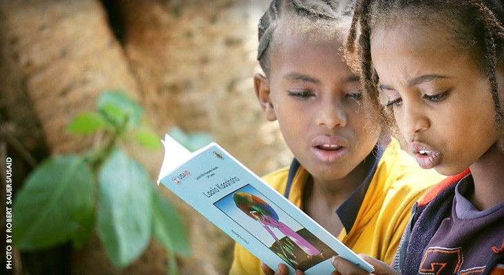 Image of Ethiopian girls reading a textbook