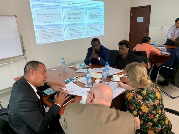 Electricidade de Moçambique executives, including General Director for Commercial, Benjamim Fernandes, learn about the HCD process during a workshop in Maputo in December 2019. 