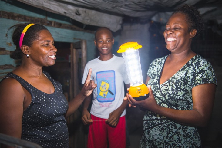 Nancy Goldman, left, explains to customers how to use the solar lamp.