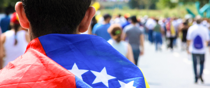 Photo of boy with Venezuelan flag