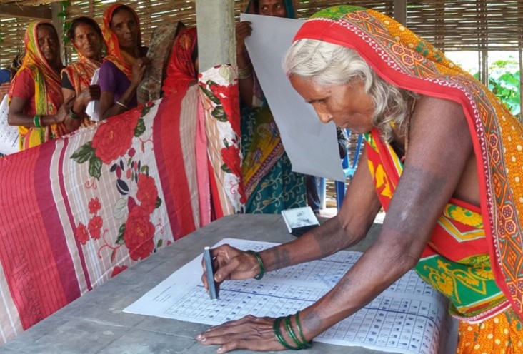Image of woman learning how to fill out ballot in 2017 elections
