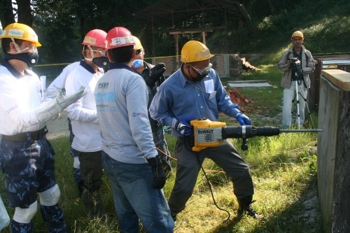 Image of about 5 Nepal men participating in a USAID-supported collapsed structure search and rescue training
