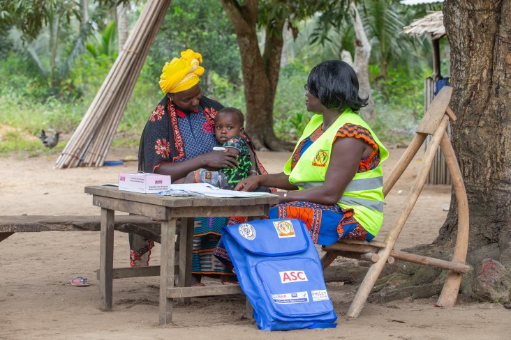 A pregnant woman receives care to protect her from malaria in Cote d'Ivoire