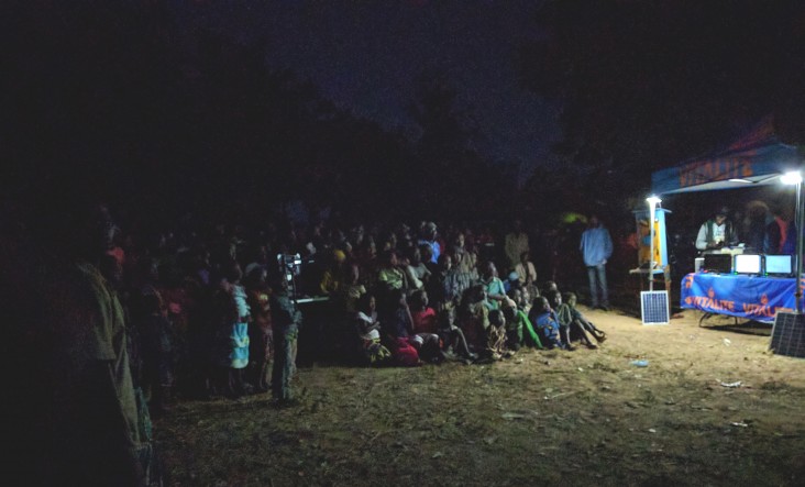 VITALITE hosts its first mobile cinema event to teach farmers how to use mobile money.