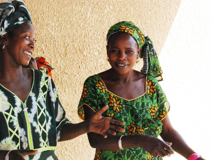 Birth attendant Fatou Diouf, left, and new mother Ami Sene