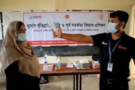 At USAID-sponsored training, volunteers and community members learn their roles and how best to protect and care for vulnerable people , such as ill and people with disabilities, during an emergency.