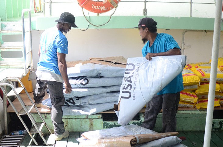 USAID partner IOM delivers plastic sheeting to provide for emergency shelter needs for hundreds of families affected by Typhoon Wutip.  