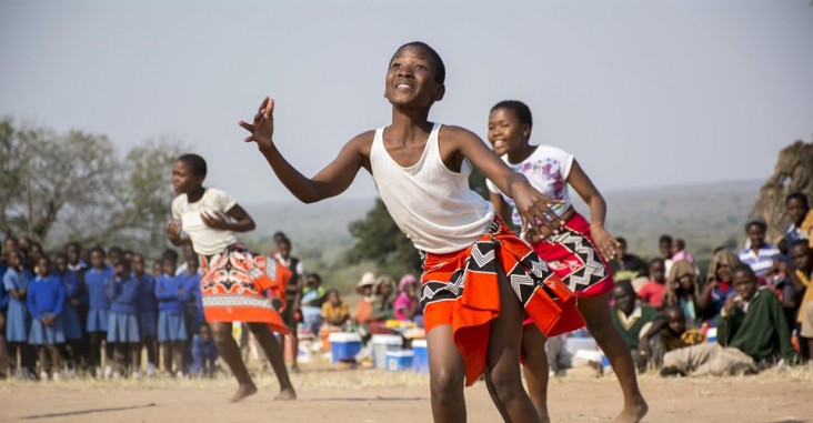 A photograph of young women dancing. Photo credit: Eric Bond/Elizabeth Glaser Pediatric AIDS Foundation
