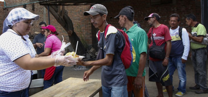 Venezuelans get food at the Casa de Paso Divina Providencia refuge in Cucuta, Colombia on July 31, 2017. The United States, Mexico, Colombia, Peru and other nations said they did not recognize the results of the election Sunday of a new "Constituent Assembly" superseding Venezuela's legislative body, the opposition-controlled National Assembly.