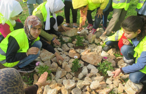 Yarmouk students participate in school beautification activities facilitated by the CET. 