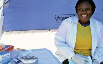 A counselor works in her tent-based counseling room at a mobile counseling and testing event in Nigeria