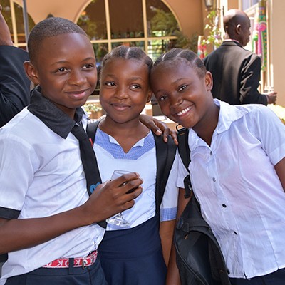 Classmates in the Democratic Republic of Congo celebrate their success after a performance at an event organized to celebrate the International Day of the Girl Child. 