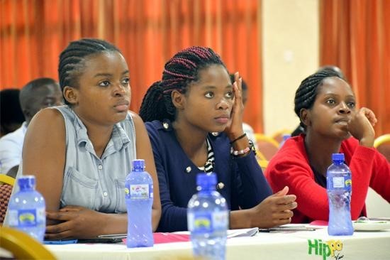 Photo of three young women participating in the induction Newly recruited health workers participate in induction in Malawi before deploying to health facilities for service. Photo credit: HRH2030