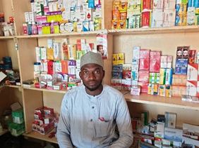 Tariq, one of the PPMV’s Zayyanu supports, sitting in his store